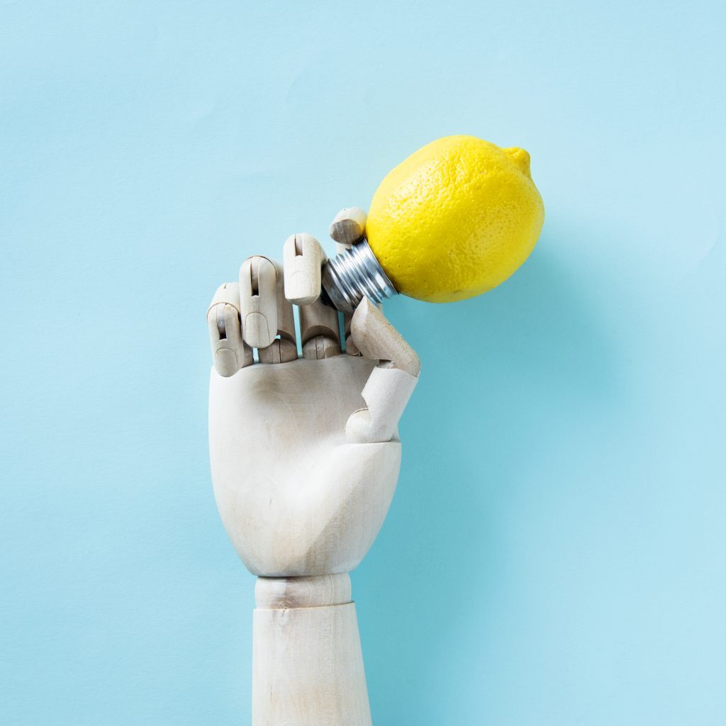 robot-hand-holding-lemon-bulb-1024x1024-1-1024x1024.jpg